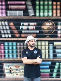 Rear view of man standing in library