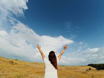 Silhouette of woman standing on landscape