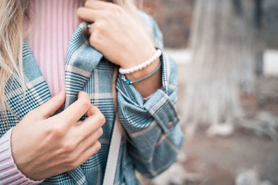 Midsection of woman holding hands