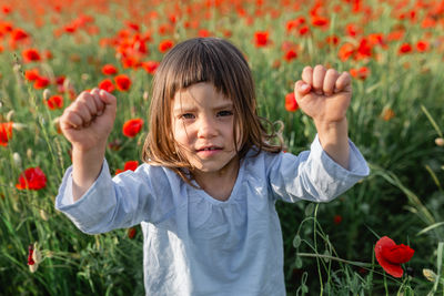 Midsection of woman holding yellow flowers