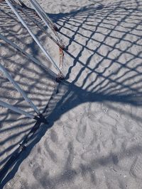 High angle view of shadow on footpath