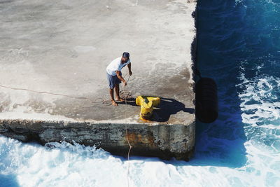 Full length of man surfing in sea