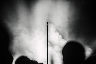 Low angle view of smoke stacks against sky