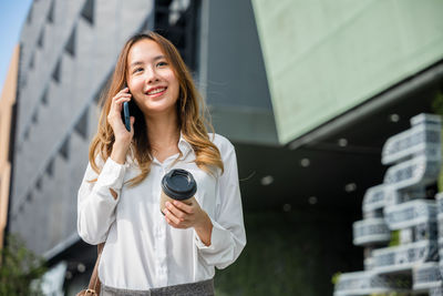 Young woman using mobile phone