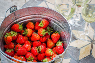 High angle view of strawberries in bowl on table