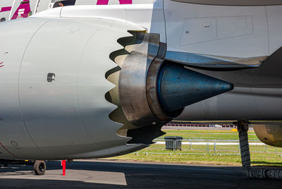 Close-up of airplane at airport runway