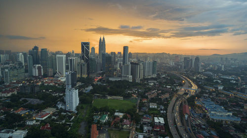 Aerial view of city at sunset