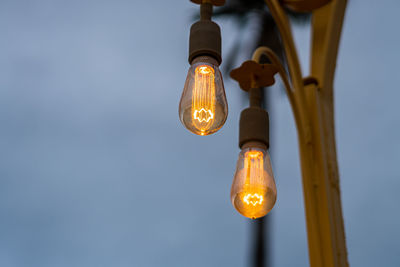 Close-up of illuminated light bulb