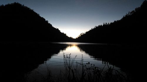 Scenic view of lake against sky during sunset