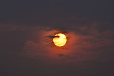 Low angle view of moon at sunset
