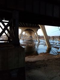 View of bridge over river during winter