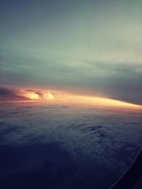 Aerial view of clouds over sea at sunset