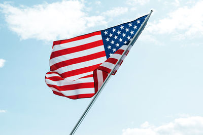 Low angle view of flag against sky