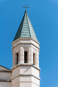 Low angle view of building against clear blue sky