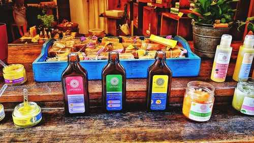 Various bottles on table at market stall