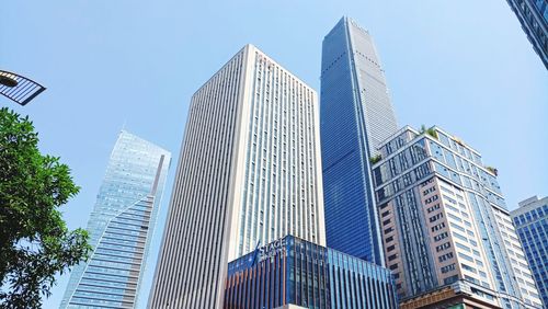 Low angle view of modern buildings against clear sky