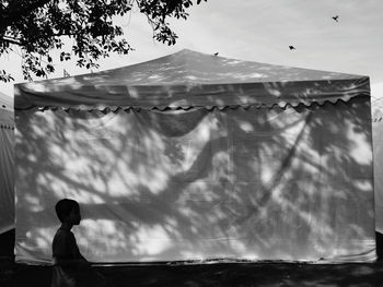 Low angle view of child against sky