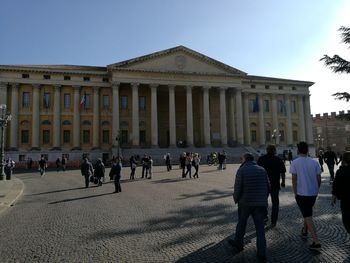 People at town square against clear sky