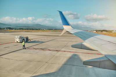 Low angle view of airplane on airport runway