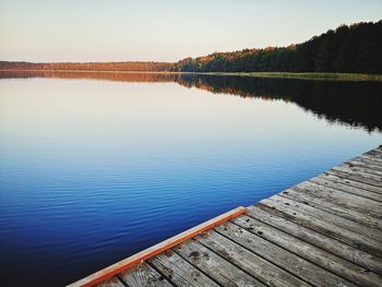 Pier over lake against sky