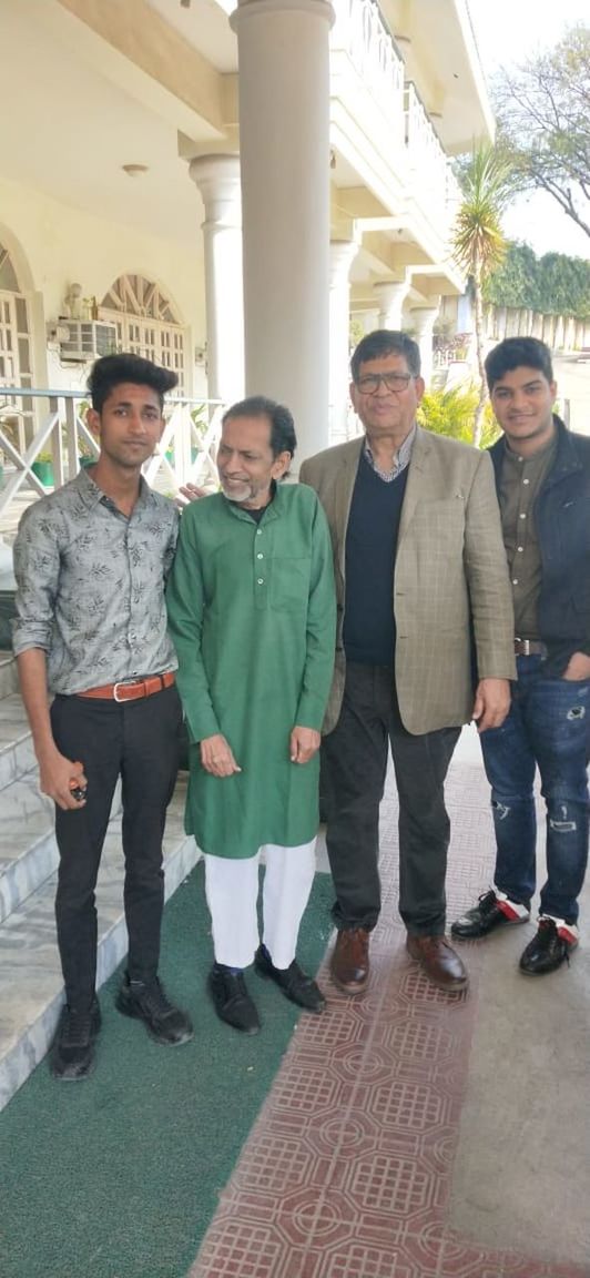 group of people, men, full length, adult, architecture, standing, togetherness, looking at camera, portrait, smiling, mature adult, women, person, happiness, day, front view, female, clothing, young adult, senior adult, footwear, child, built structure, business, emotion, occupation, cooperation