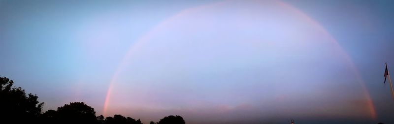 Low angle view of rainbow in sky