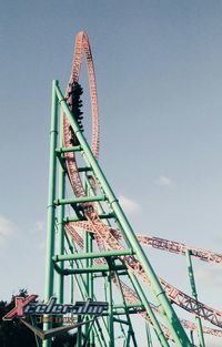 Low angle view of rollercoaster against sky