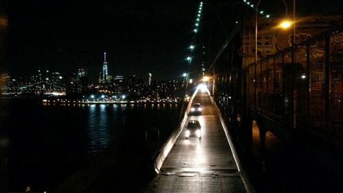 Bridge over river at night