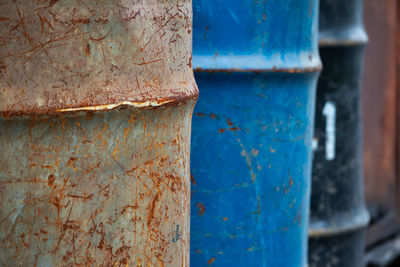 Close-up of rusty metal against wall