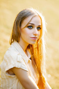 Smokey ice makeup. portrait of a young beautiful girl on the background of the setting sun