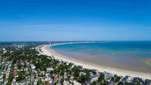 Scenic view of sea against blue sky