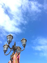 Low angle view of street light against sky