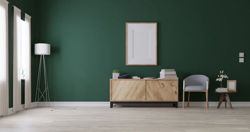 Empty chairs and table against wall at home