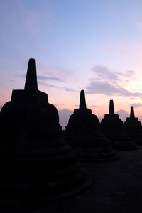 Ancient temple against sky during sunset