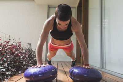 Woman training and stretching outdoors