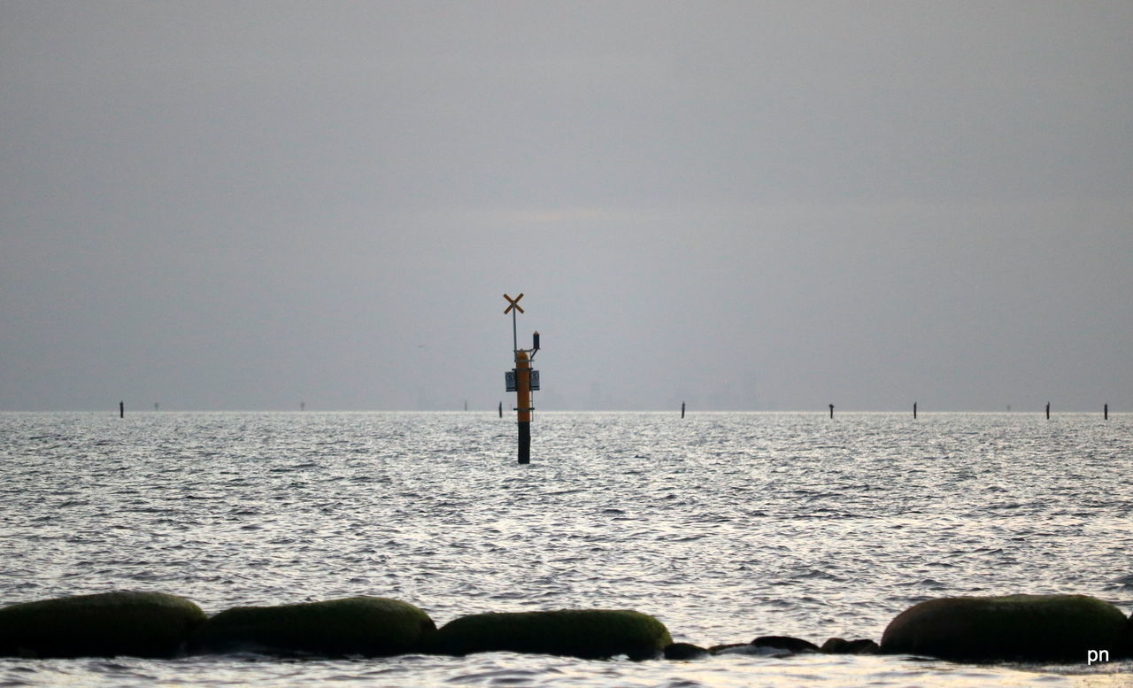 VIEW OF CALM SEA AGAINST SKY