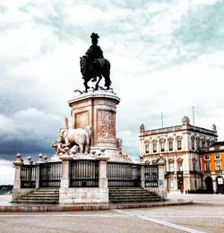 Low angle view of statue against cloudy sky