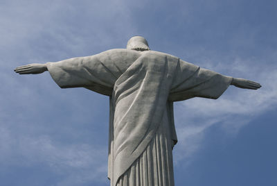Low angle view of statue against sky