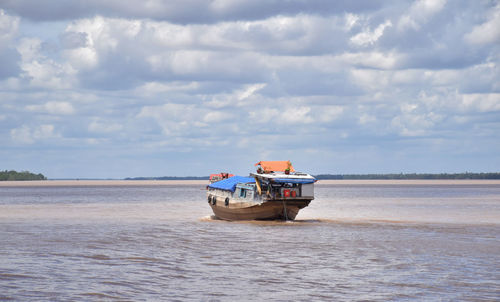 A boat on a branch of mekong river, vietnam.