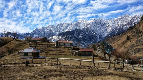 Scenic view of snowcapped mountains against sky