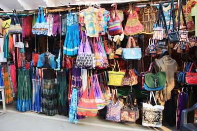 Clothes hanging in store for sale at market stall