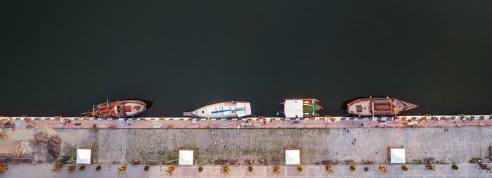 Panoramic view by drone of yachts or small boats moored at the quay. parking