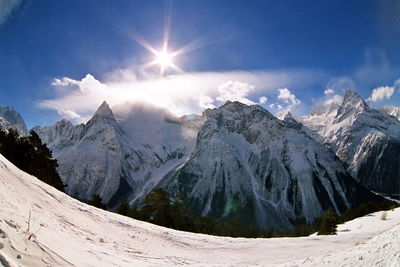 Scenic view of snowcapped mountains against sky