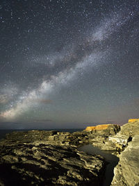 Aerial view of sea against sky at night