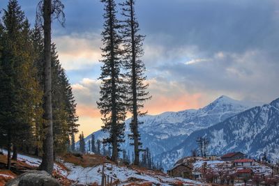 Scenic view of snowcapped mountains against sky during winter