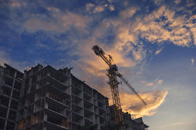 Low angle view of tower crane against sky