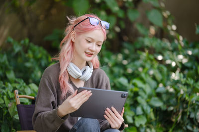 Young woman using mobile phone