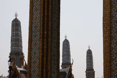 Low angle view of towers at wat phra kaew