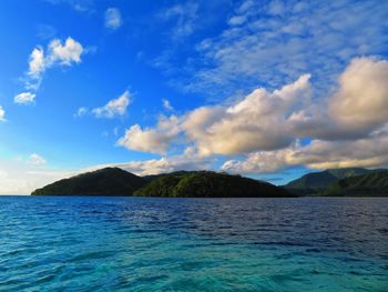 Scenic view of sea against blue sky