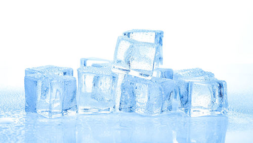 Close-up of ice cubes against white background